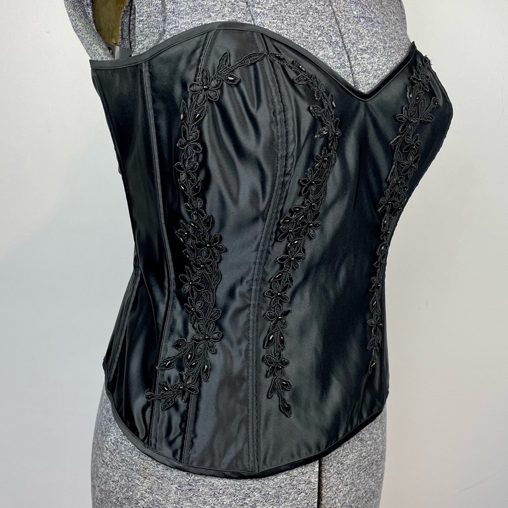 Intimate attitude black corset bustier with black beaded appliqué. Size 38